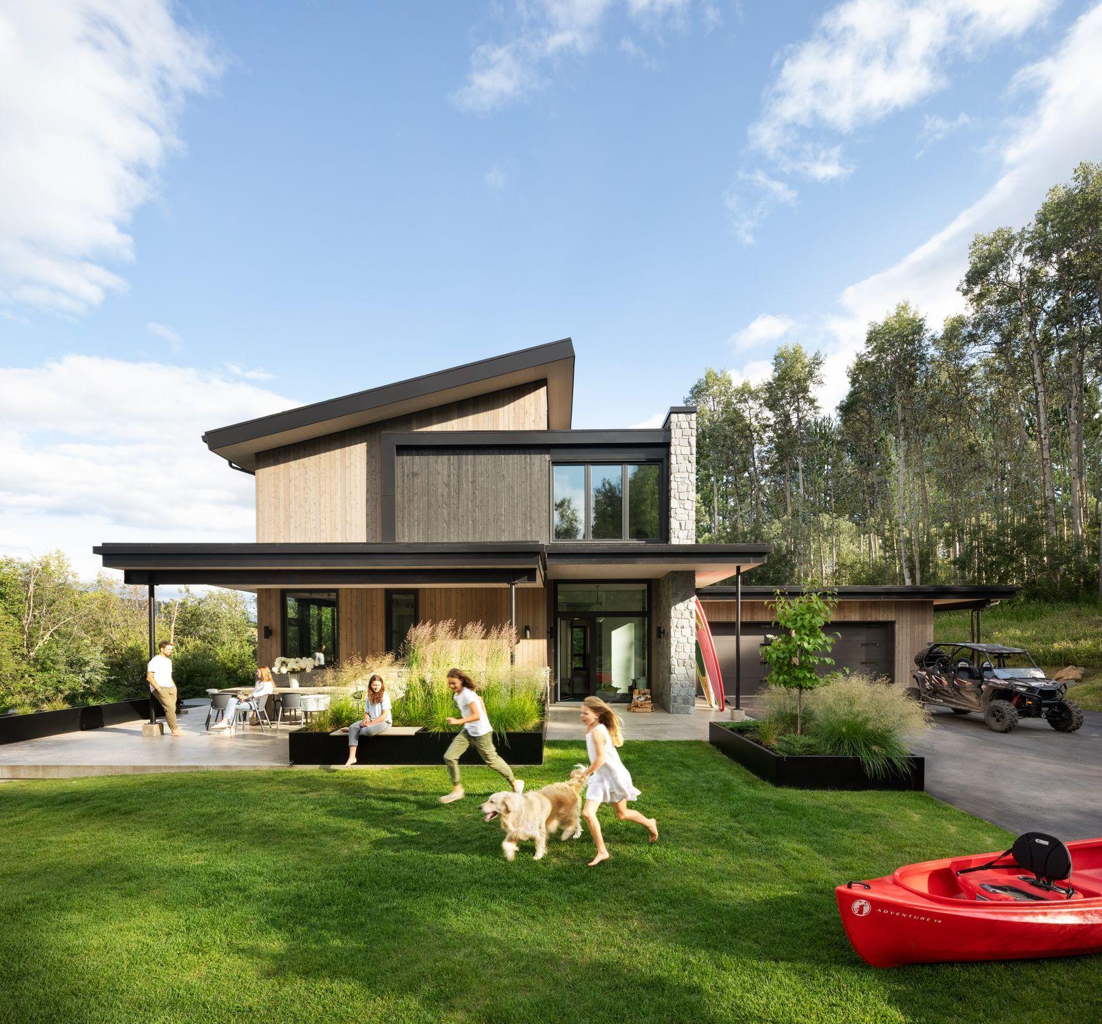Canadian residential home with family and vehicle in driveway